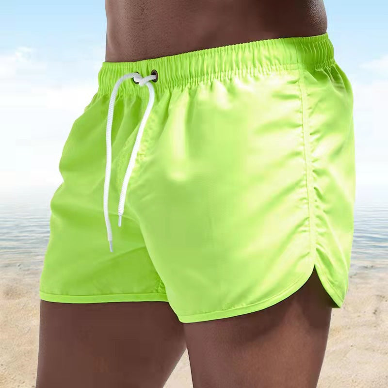 Men's solid swim shorts with elasticated drawstring waist and side pockets