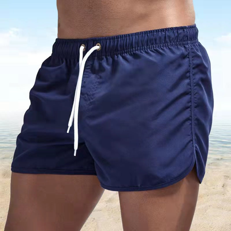 Men's solid swim shorts with elasticated drawstring waist and side pockets