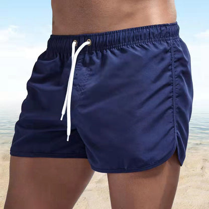 Men's solid swim shorts with elasticated drawstring waist and side pockets