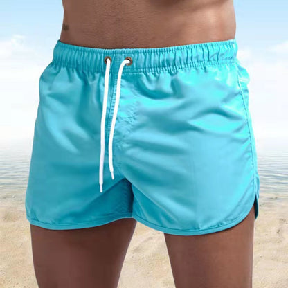 Men's solid swim shorts with elasticated drawstring waist and side pockets