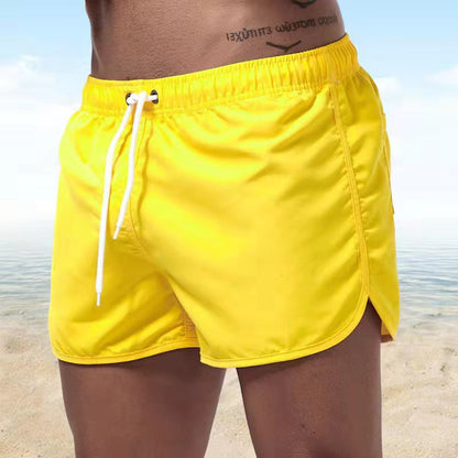 Men's solid swim shorts with elasticated drawstring waist and side pockets