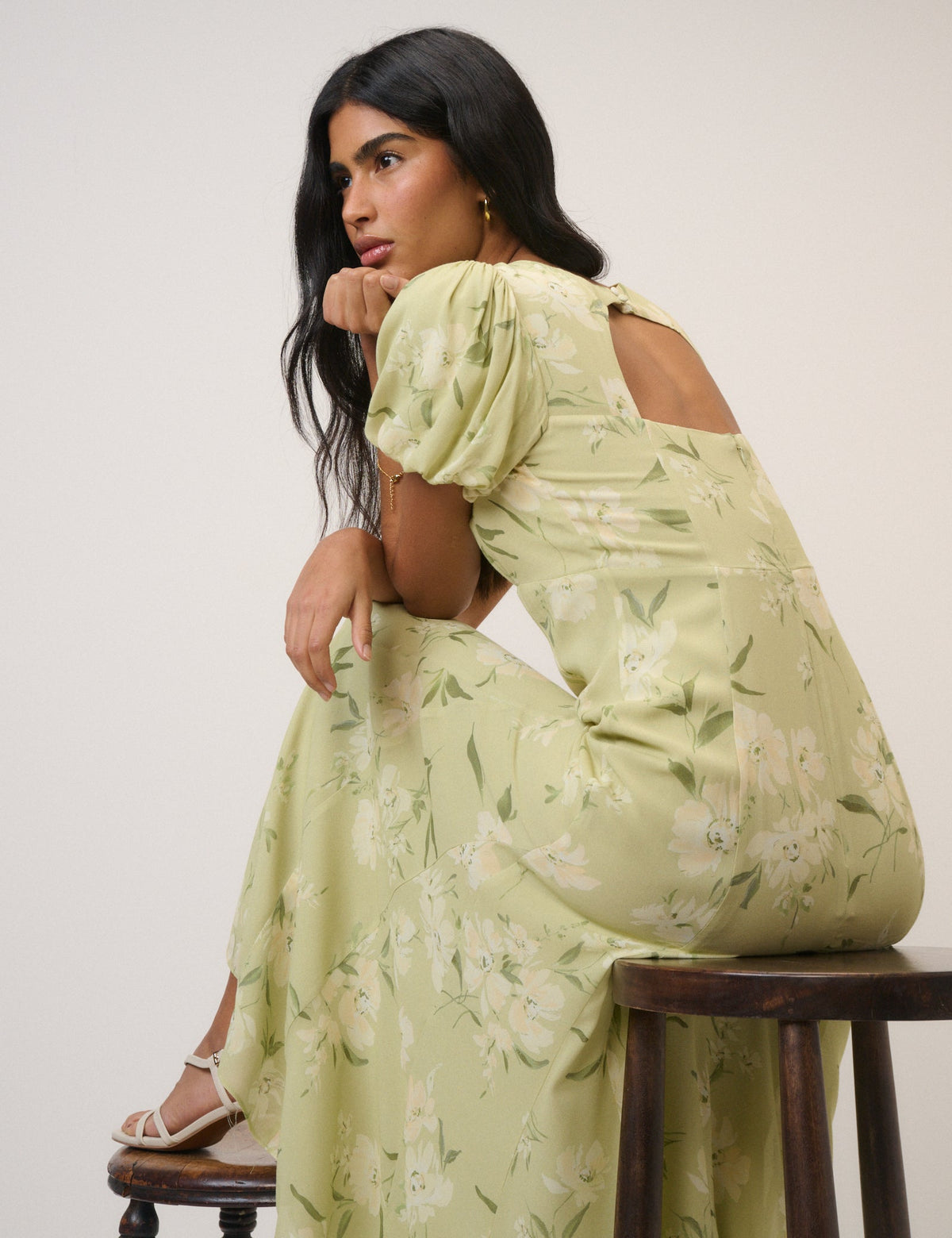 Women's pale green floral maxi dress with short puff sleeves and open back