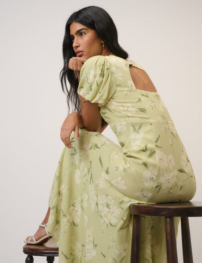 Women's pale green floral maxi dress with short puff sleeves and open back