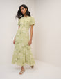 Women's pale green floral maxi dress with short puff sleeves and open back
