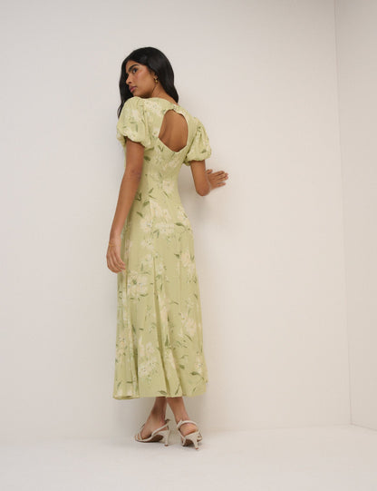 Women's pale green floral maxi dress with short puff sleeves and open back