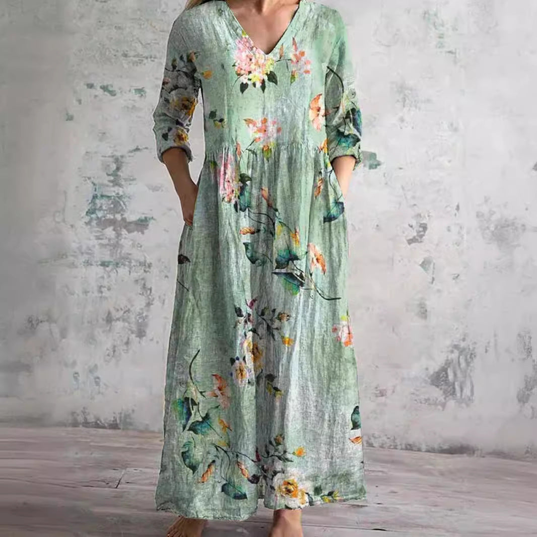 Women's floral V-neck maxi dress with three-quarter sleeves, gathered waist and side pockets