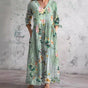 Women's floral V-neck maxi dress with three-quarter sleeves, gathered waist and side pockets