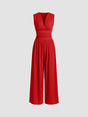 Sleeveless wide-leg jumpsuit with deep V-neckline and ruched waist