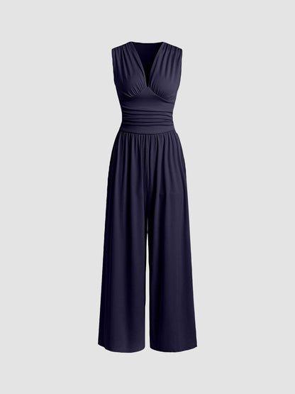 Sleeveless wide-leg jumpsuit with deep V-neckline and ruched waist