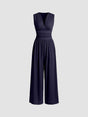 Sleeveless wide-leg jumpsuit with deep V-neckline and ruched waist