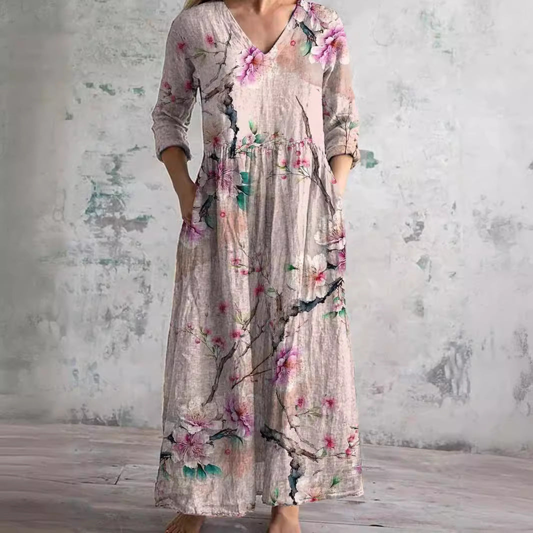 Women's floral V-neck maxi dress with three-quarter sleeves, gathered waist and side pockets