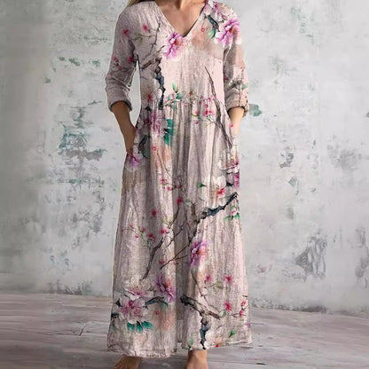 Women's floral V-neck maxi dress with three-quarter sleeves, gathered waist and side pockets