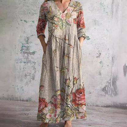 Women's floral V-neck maxi dress with three-quarter sleeves, gathered waist and side pockets