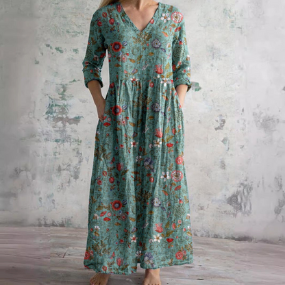 Women's floral V-neck maxi dress with three-quarter sleeves, gathered waist and side pockets