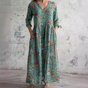 Women's floral V-neck maxi dress with three-quarter sleeves, gathered waist and side pockets