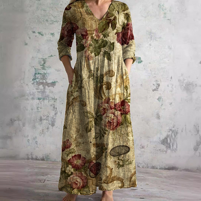 Women's floral V-neck maxi dress with three-quarter sleeves, gathered waist and side pockets
