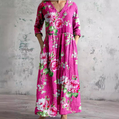 Women's floral V-neck maxi dress with three-quarter sleeves, gathered waist and side pockets