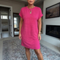 Women's textured short dress with crew neckline, short sleeves and side pockets