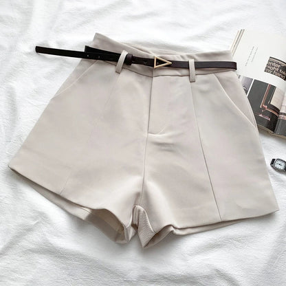 Women's high-waisted tailored shorts with a belt and triangular buckle