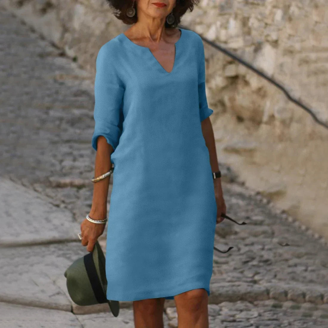 Women's straight mini dress with V-neckline and three-quarter sleeves