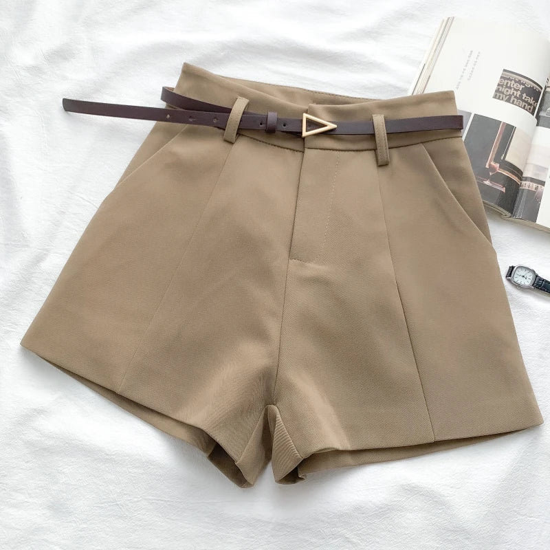 Women's high-waisted tailored shorts with a belt and triangular buckle