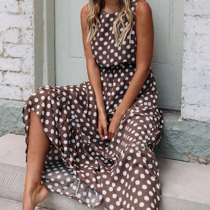 Women's sleeveless polka dot midi dress with a round neckline and flowing skirt