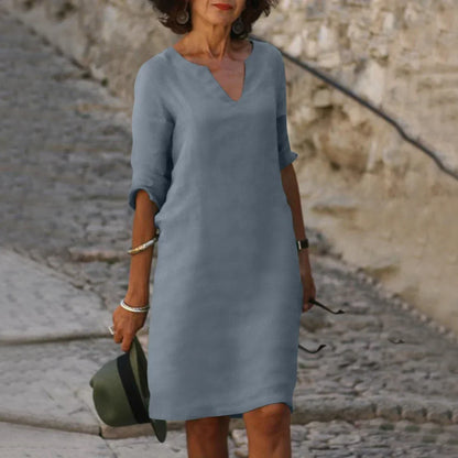 Women's straight mini dress with V-neckline and three-quarter sleeves