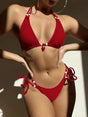 Women's textured triangle bikini set with halter ties, side-tie bottoms and beaded details