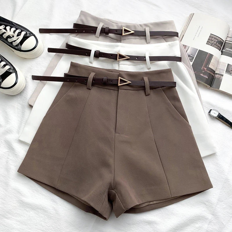 Women's high-waisted tailored shorts with a belt and triangular buckle