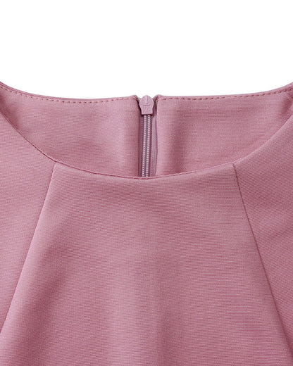 Women's fitted midi pencil dress with long sleeves, round neckline and sculptural waist details