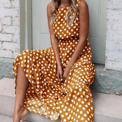Women's sleeveless polka dot midi dress with a round neckline and flowing skirt
