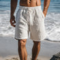 Men's knee-length swim shorts with elasticated drawstring waist and side pockets
