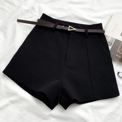 Women's high-waisted tailored shorts with a belt and triangular buckle