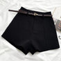 Women's high-waisted tailored shorts with a belt and triangular buckle