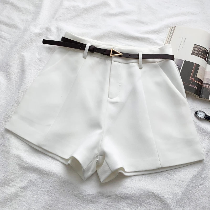 Women's high-waisted tailored shorts with a belt and triangular buckle
