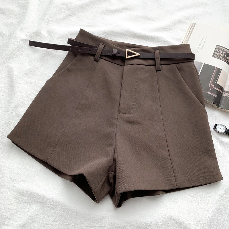 Women's high-waisted tailored shorts with a belt and triangular buckle