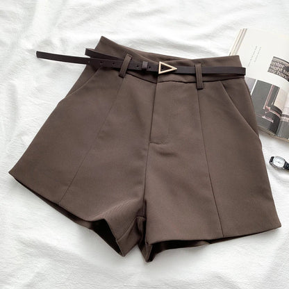 Women's high-waisted tailored shorts with a belt and triangular buckle