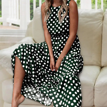Women's sleeveless polka dot midi dress with a round neckline and flowing skirt