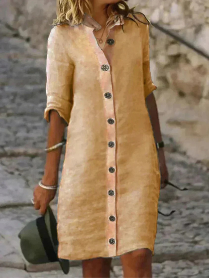 Women's collared button-down shirt dress with rolled long sleeves and knee-length hem