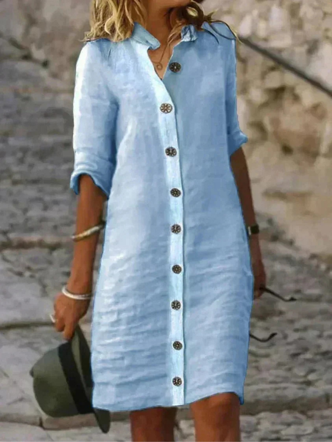 Women's collared button-down shirt dress with rolled long sleeves and knee-length hem