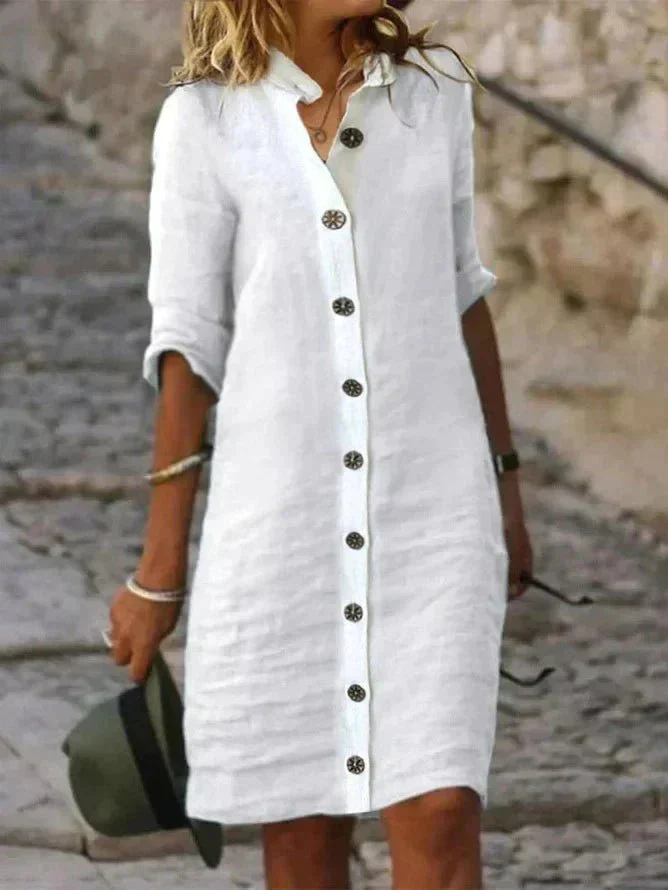 Women's collared button-down shirt dress with rolled long sleeves and knee-length hem