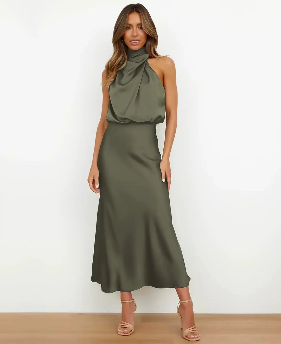 Women's sleeveless halter midi dress with a draped neckline and fitted skirt
