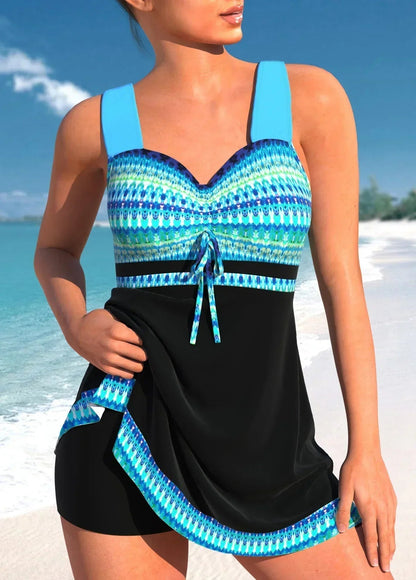 Women's patterned one-piece swimsuit with sweetheart neckline, waist tie and short skirt overlay