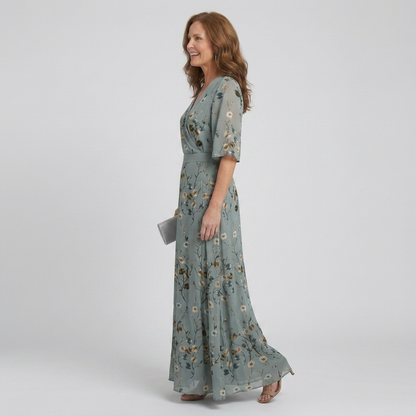 Women's green floral wrap maxi dress with V-neckline and elbow-length sleeves