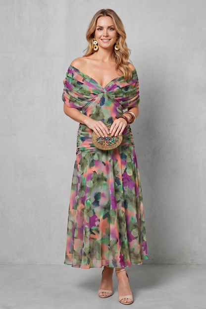 Women's floral wrap maxi dress with draped off-shoulder bodice and flowing ankle-length skirt