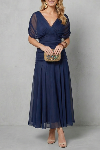 Women's floral wrap maxi dress with draped off-shoulder bodice and flowing ankle-length skirt