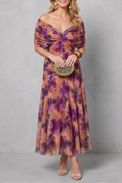 Women's floral wrap maxi dress with draped off-shoulder bodice and flowing ankle-length skirt