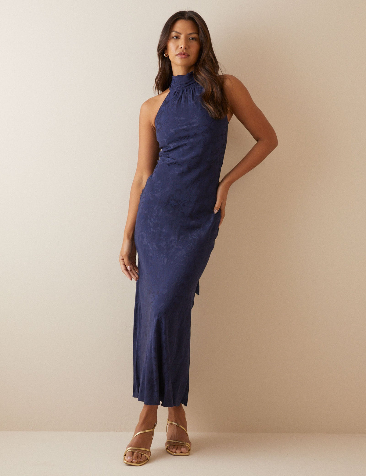 Women's navy floral sleeveless maxi dress with gathered mock neck and back ties