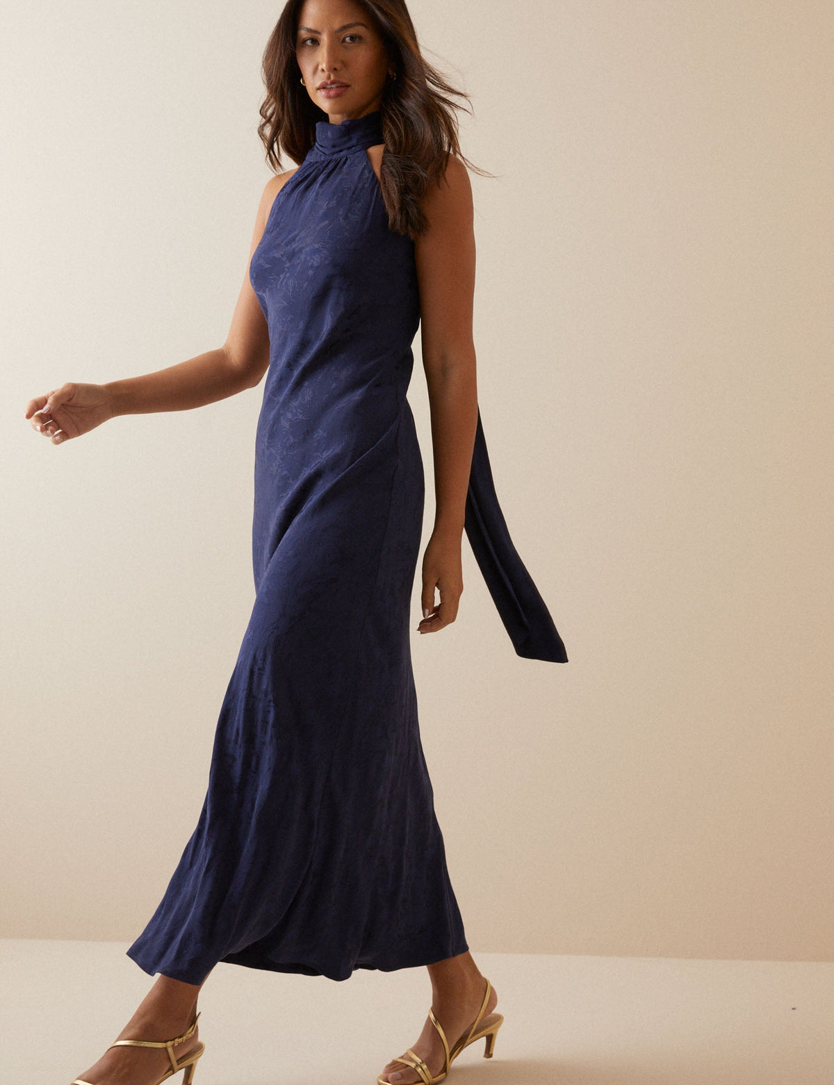 Women's navy floral sleeveless maxi dress with gathered mock neck and back ties