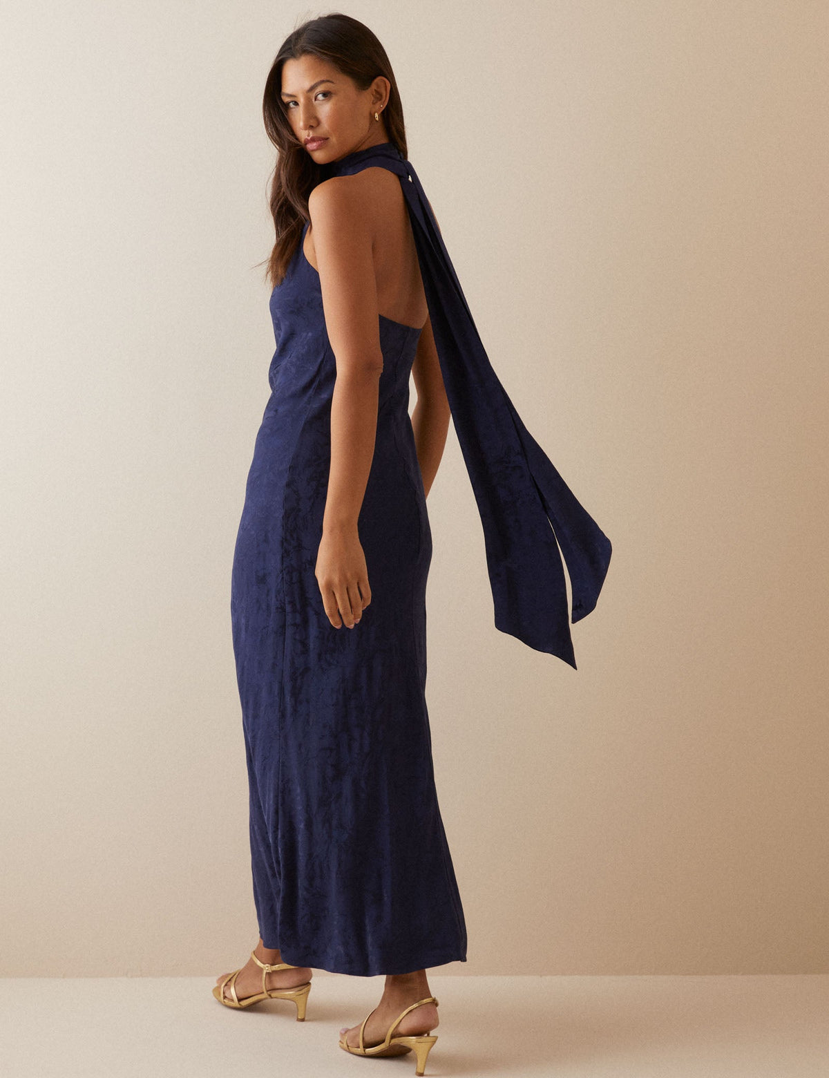 Women's navy floral sleeveless maxi dress with gathered mock neck and back ties